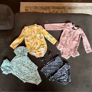 Bundle of 4 Infant bathing suits.  See pics for sizes. Excellent Condition.
